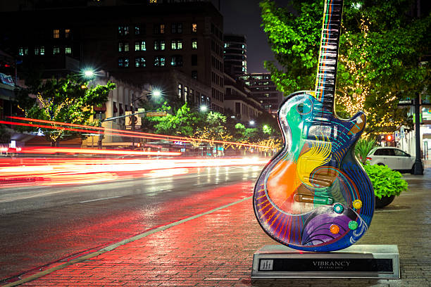 Austin Texas Congress Avenue Panoramic View at Night Austin, USA - November 5, 2016: Vibrancy by Craig Hein is one of the Guitar town Austin art project Guitars on Congress Avenue in Austin, Texas. austin texas photos stock pictures, royalty-free photos & images