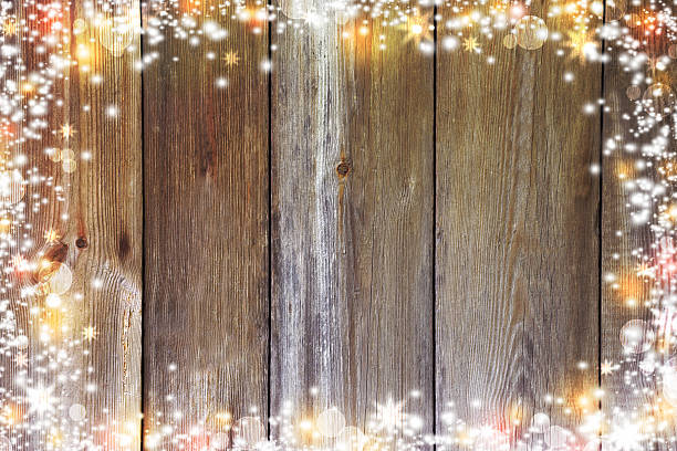 istock Christmas background with lights, bokeh, stars and snow. Old boards. 622801682
