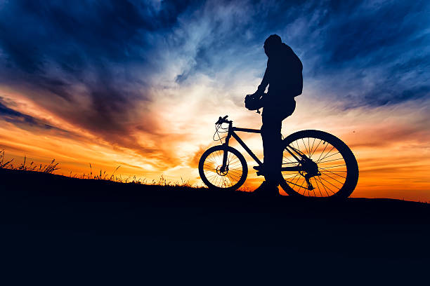 istock Silhouette of bicyclist preparing for the trail run 622801696
