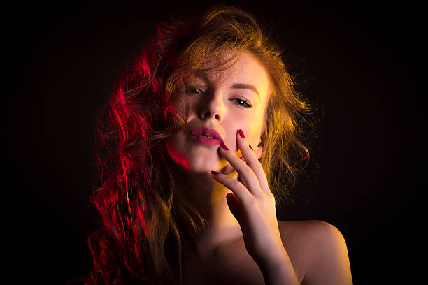 istock Fabulous woman with shadow on her face and red light 622801826