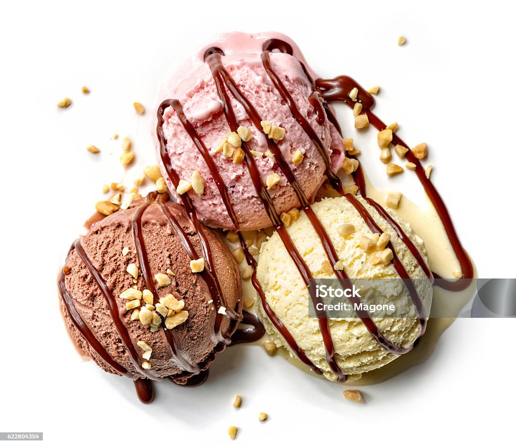 various ice cream balls with chocolate sauce various ice cream balls with chocolate sauce and nuts isolated on white background, top view Ice Cream Stock Photo