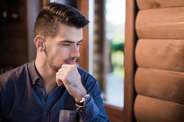 istock Young businessman deep thinking indoors 622804704