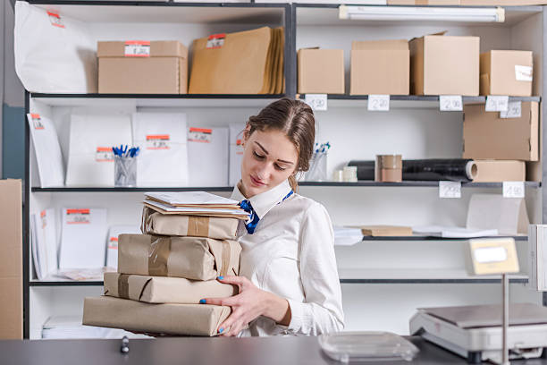 istock woman working at the post office 622806296