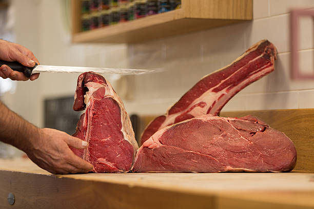 istock Butcher Preparing Meat In Shop 622806484