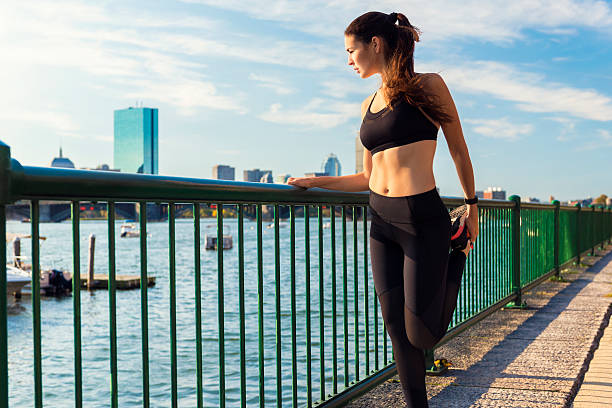 istock Female Runner Stretching While Enjoying the View in Boston, USA 622807258