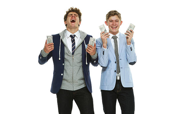 istock Cheerful brothers holding money 622808874