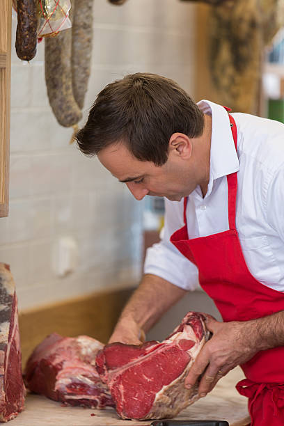 istock Butcher Preparing Meat In Shop 622809028
