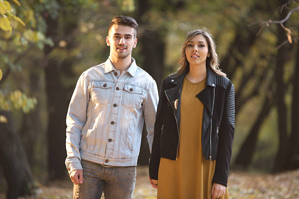 istock Young romantic couple in the woods during autumn 622809058