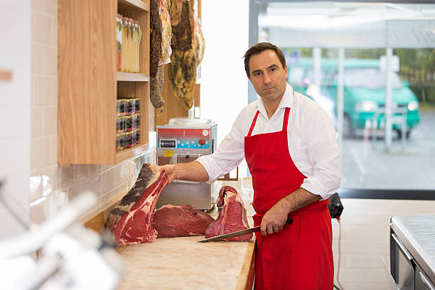 istock Butcher Preparing Meat In Shop 622809530