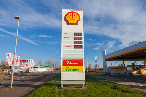 Burg, Germany - November 13, 2016: Shell gas station sign. Shell is an Anglo-Dutch multinational oil and gas company headquartered in the Netherlands and incorporated in the United Kingdom.