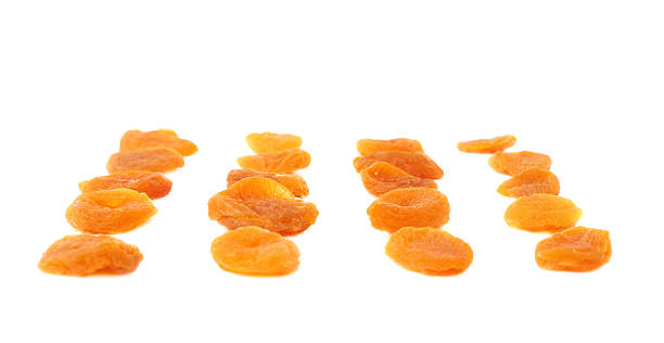 istock Dried orange apricots over white background 622889824
