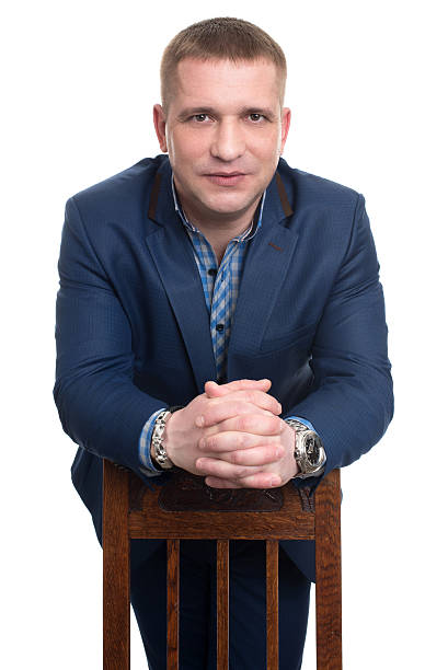 istock businessman leans on a chair 622892306