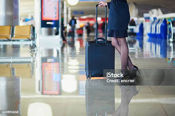 Young Female Traveler In International Airport Stock Photo - Download Image Now - Air Stewardess, Crew, Airport