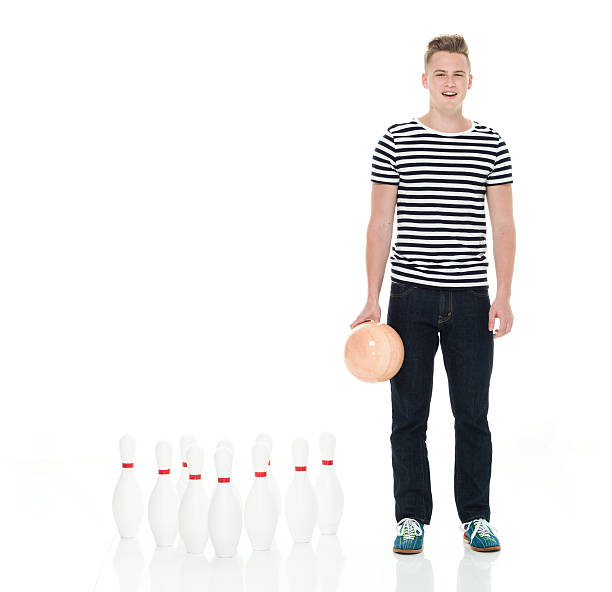 homme souriant tenant boule de quilles - bowling isolated sportsman vertical photos et images de collection