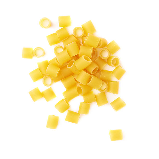 Pile of dry ditalini pasta over isolated white background