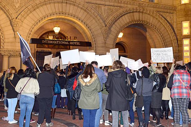 Leftists and instigators protesting Donald Trump election win Washington DC, USA - November 10, 2016: While Donald Trump won the Presidential Election, many people, particularly leftists, are unable to accept the results and engage in protests in several cities. hillary clinton stock pictures, royalty-free photos & images