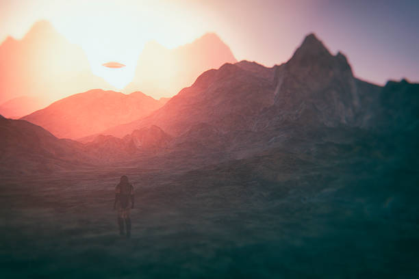 istock Astronaut walking on Mars, UFO flying 622899166