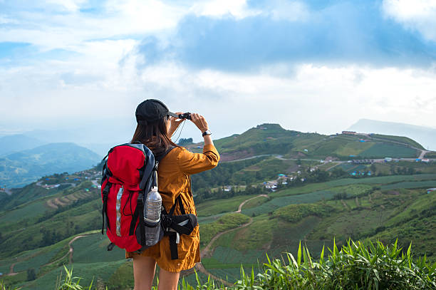 istock Hiker woman look binoculars on the mountain, 622899854