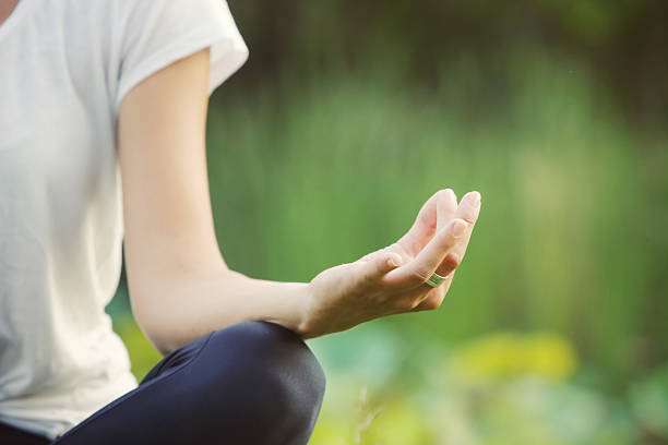istock Young girl doing yoga in the park 622899998