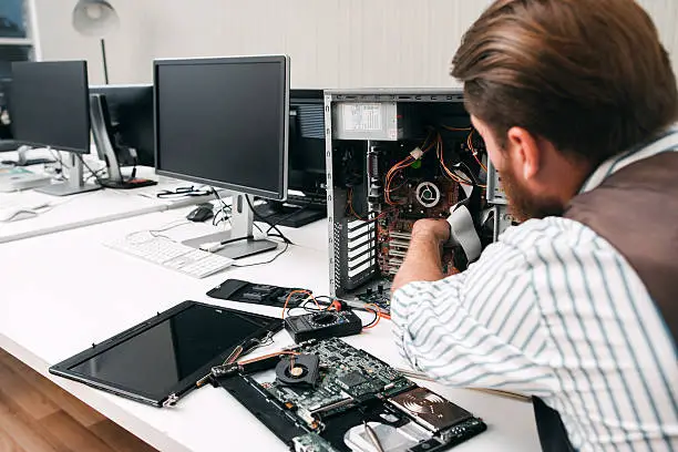 Photo of Broken computer disassembling, close-up