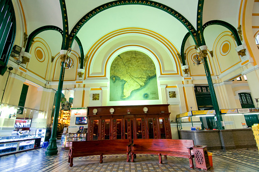 Ho Chi Minh, Vietnam - March 8, 2015: Saigon Central Post Office is a post office in the downtown Ho Chi Minh City, near Saigon Notre-Dame Basilica, the city's cathedral. The building was constructed when Vietnam was part of French Indochina in the late 19th century. It counts with Gothic, Renaissance and French influences. It was constructed between 1886-1891 and is now a tourist attraction.