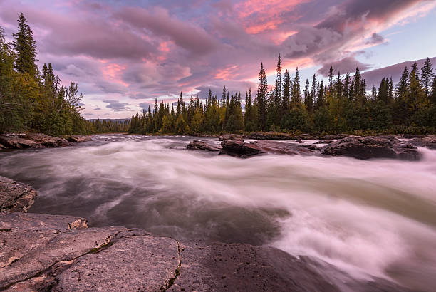 istock Vibrant sunset over wild streaming river with dramatic background, Sweden 622914428
