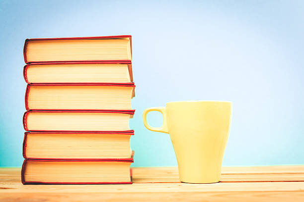 istock Color cup of tea with books on table 622914742