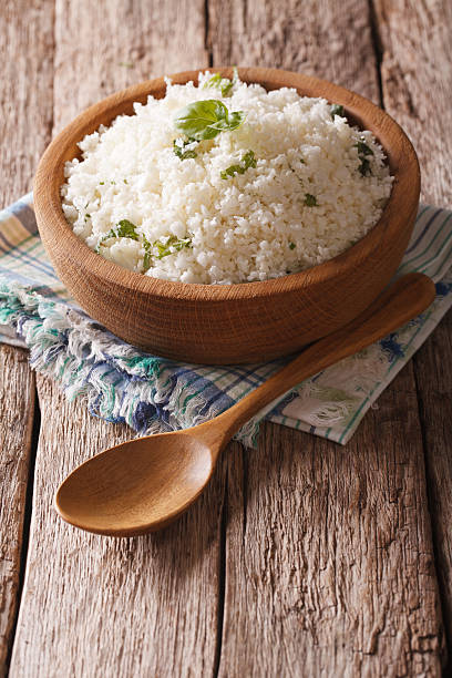 istock Paleo Food: Cauliflower rice with herbs close-up. Vertical 622915872