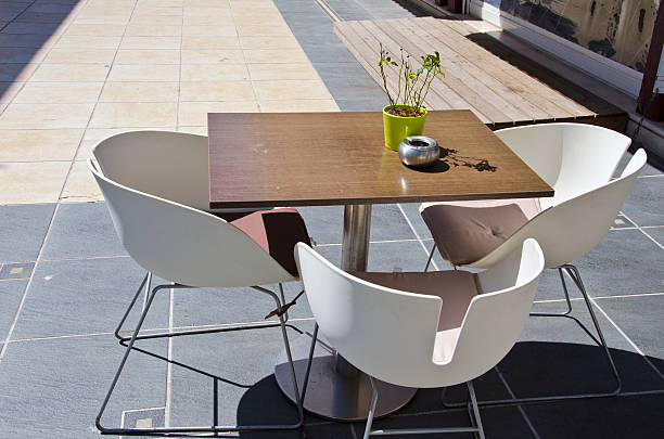 istock Cafe table and chairs in street, Greece 622916252