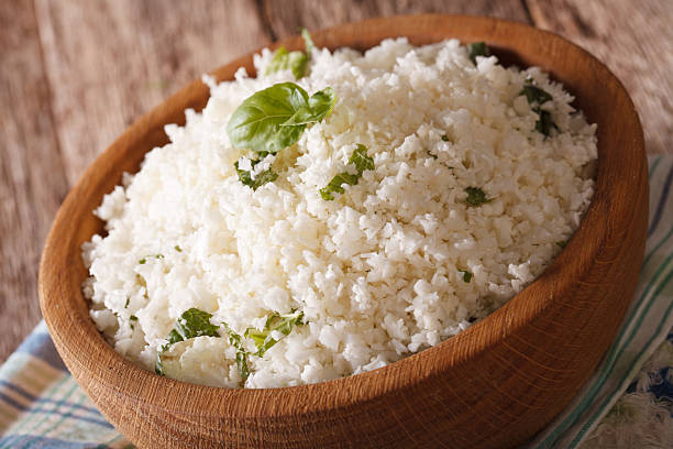 istock Cauliflower rice with basil in a bowl close-up. horizontal 622916284