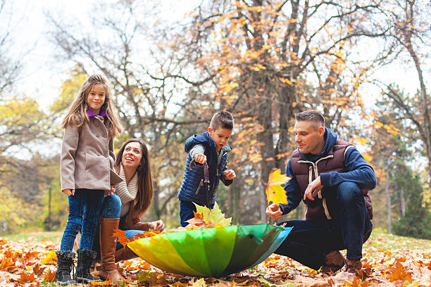 istock Happy family having fun in park. 622916392
