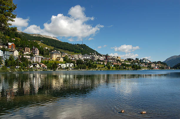 Cityscape of Saint Moritz with lake, blue sky and clouds. Engadin, Switzerland, Europe