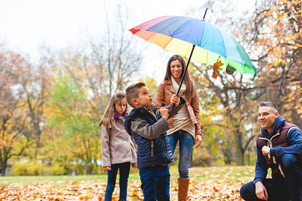 istock The boy spinning a colorful umbrella 622916624