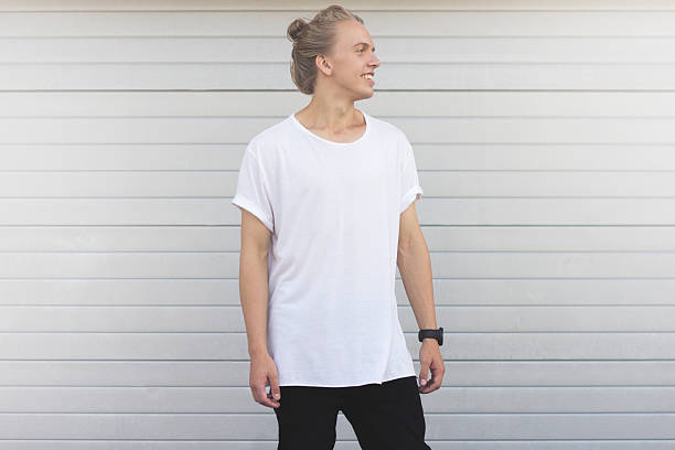 istock Handsome guy  standing in the white blank T-shirt 622917106