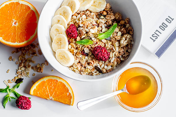 istock Breakfast with oatmeal and to do list on white background 622921408