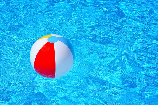 istock Colorful inflatable ball floating in swimming pool 622922342