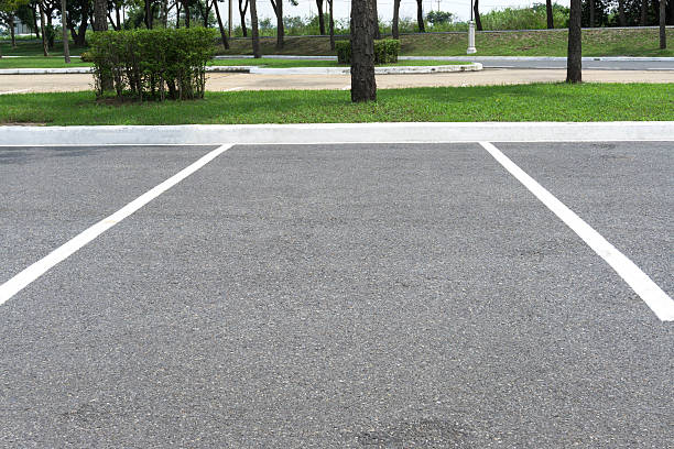 istock Empty space parking lot outdoor in public park. 622922480
