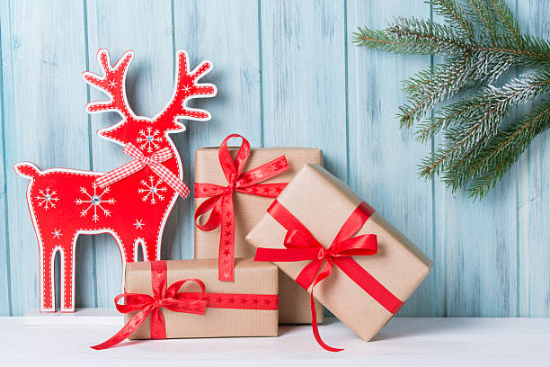 istock Christmas decorations with gift boxes, deer and fir tree 622922802