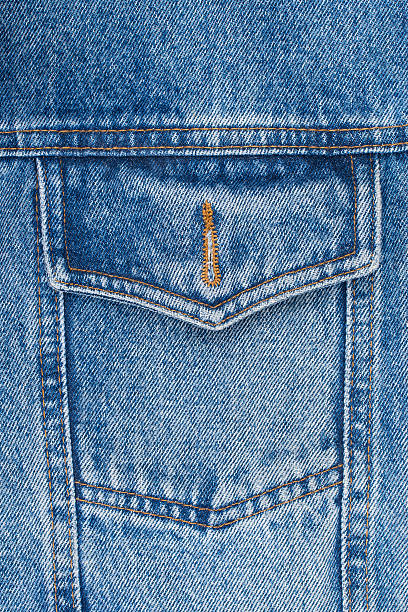 closeup detail of a vintage denim jacket closeup detail of a vintage denim jacket. Top view. denim jacket stock pictures, royalty-free photos & images