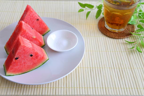 Whole & Sliced fresh watermelon and iced barley tea