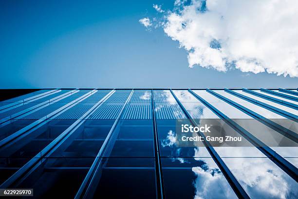 Clouds Reflected In Windows Of Modern Office Building Stock Photo - Download Image Now