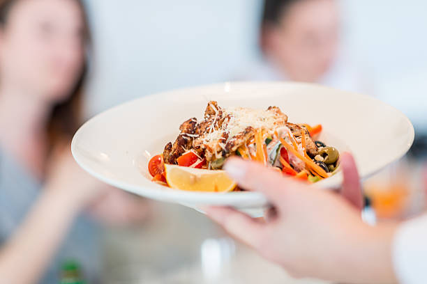 istock Serving food in restaurant 622926074