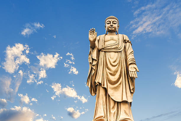 istock Buddha statue on the blue sky 622954956