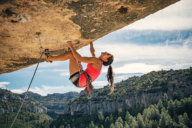 Female rock climber in Margalef Catalonia Spain Young woman rock climbing in Margalef Catalonia Spain extreme sports photos stock pictures, royalty-free photos & images