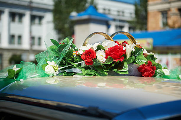 istock wedding car decorated with red flowers 622957814