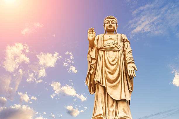 istock Buddha statue on the blue sky 622958380