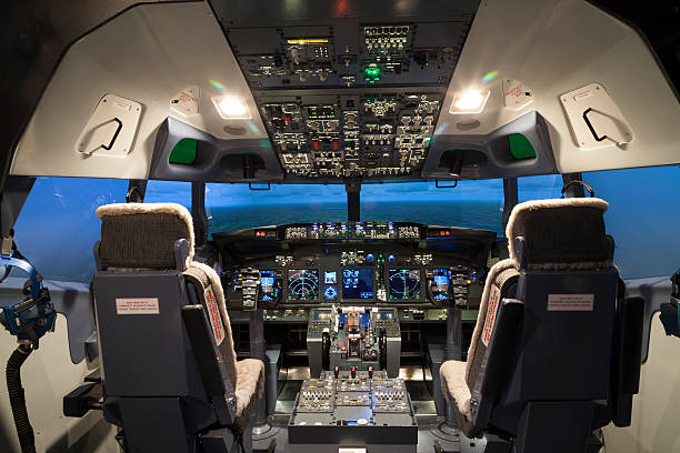 Seat and controller in cock pit of flight simulator Seat and controller in cock pit of flight simulator cockpit stock pictures, royalty-free photos & images