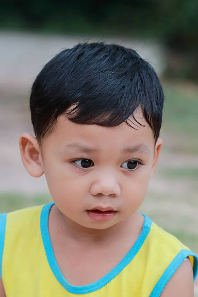istock The boy standing eyes staring ahead. 622966992