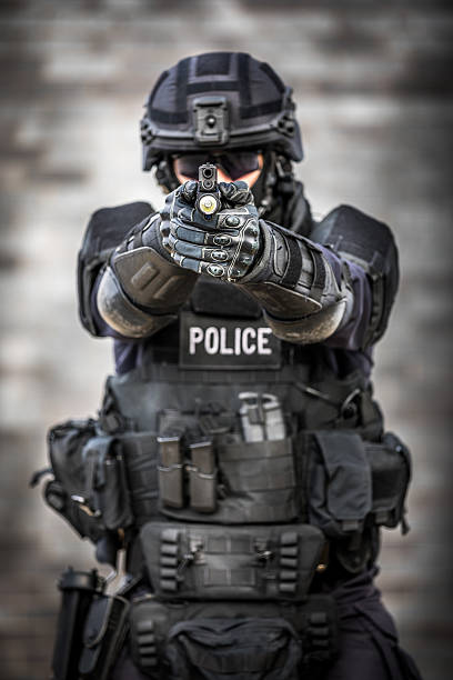 istock SWAT Police Officer Against Brick Wall 622968102