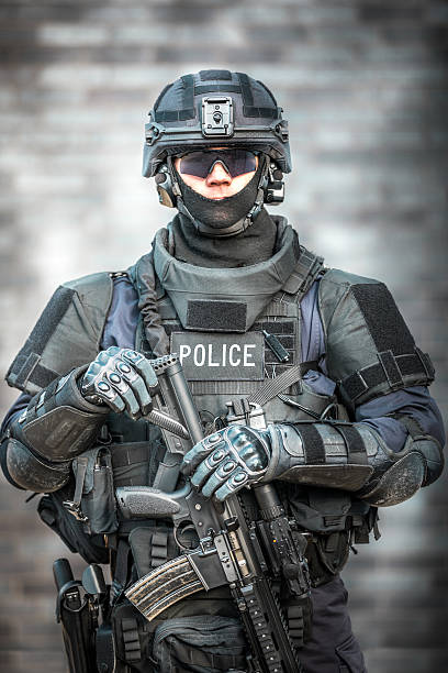 istock SWAT Police Officer Against Brick Wall 622968740